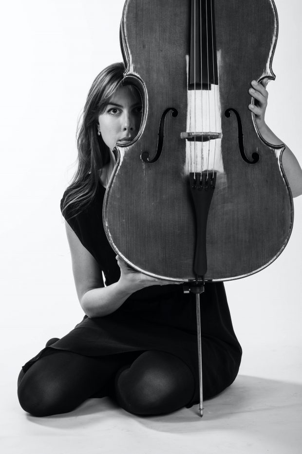 woman in black dress playing violin